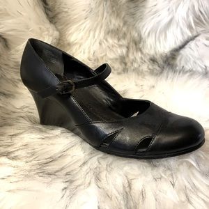 Black leather wedges, high heels.   Size 7 1/2